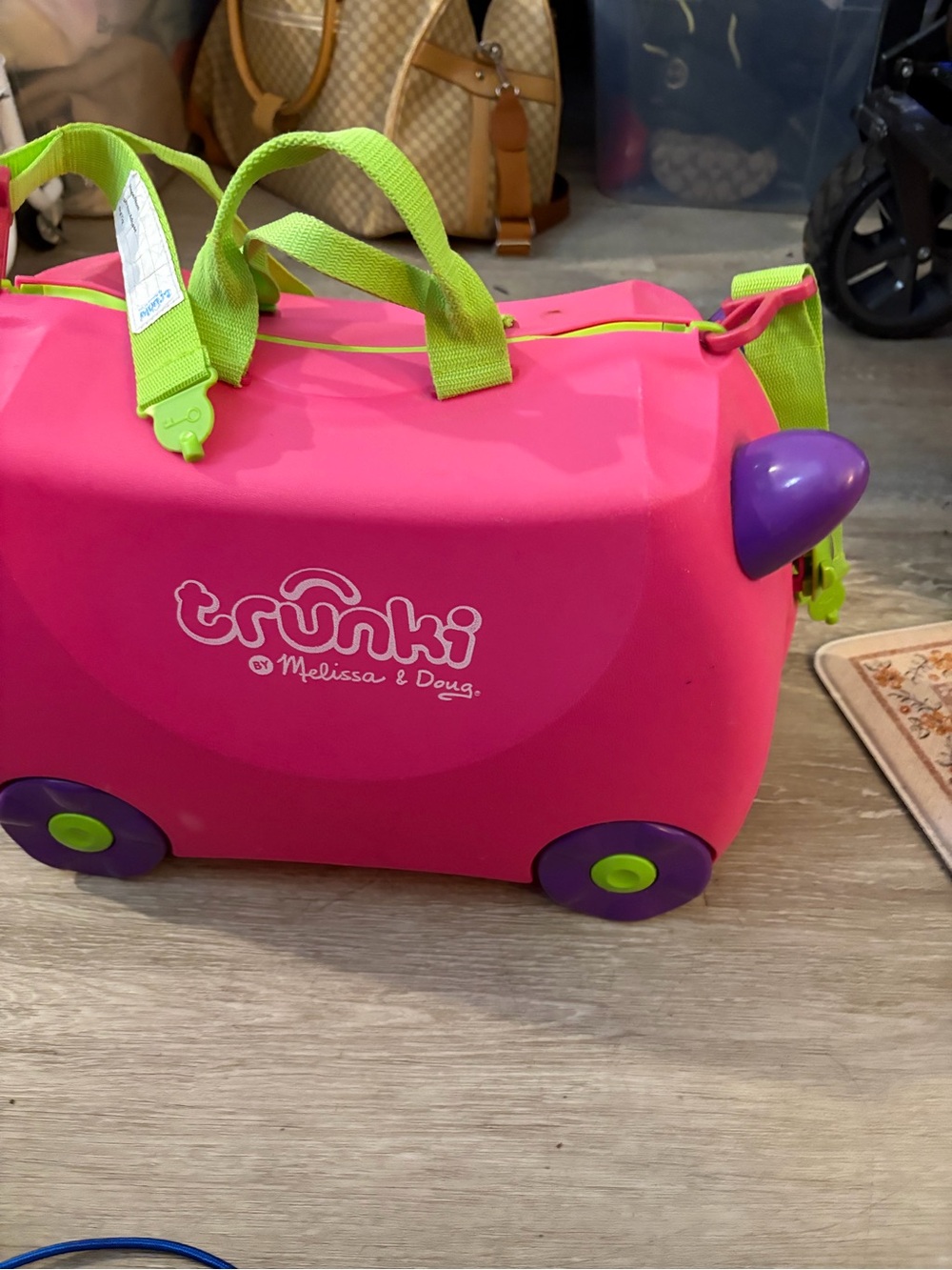 Melissa & Doug Pink Ride-On Trunki with Lime Green Straps and Purple Wheels